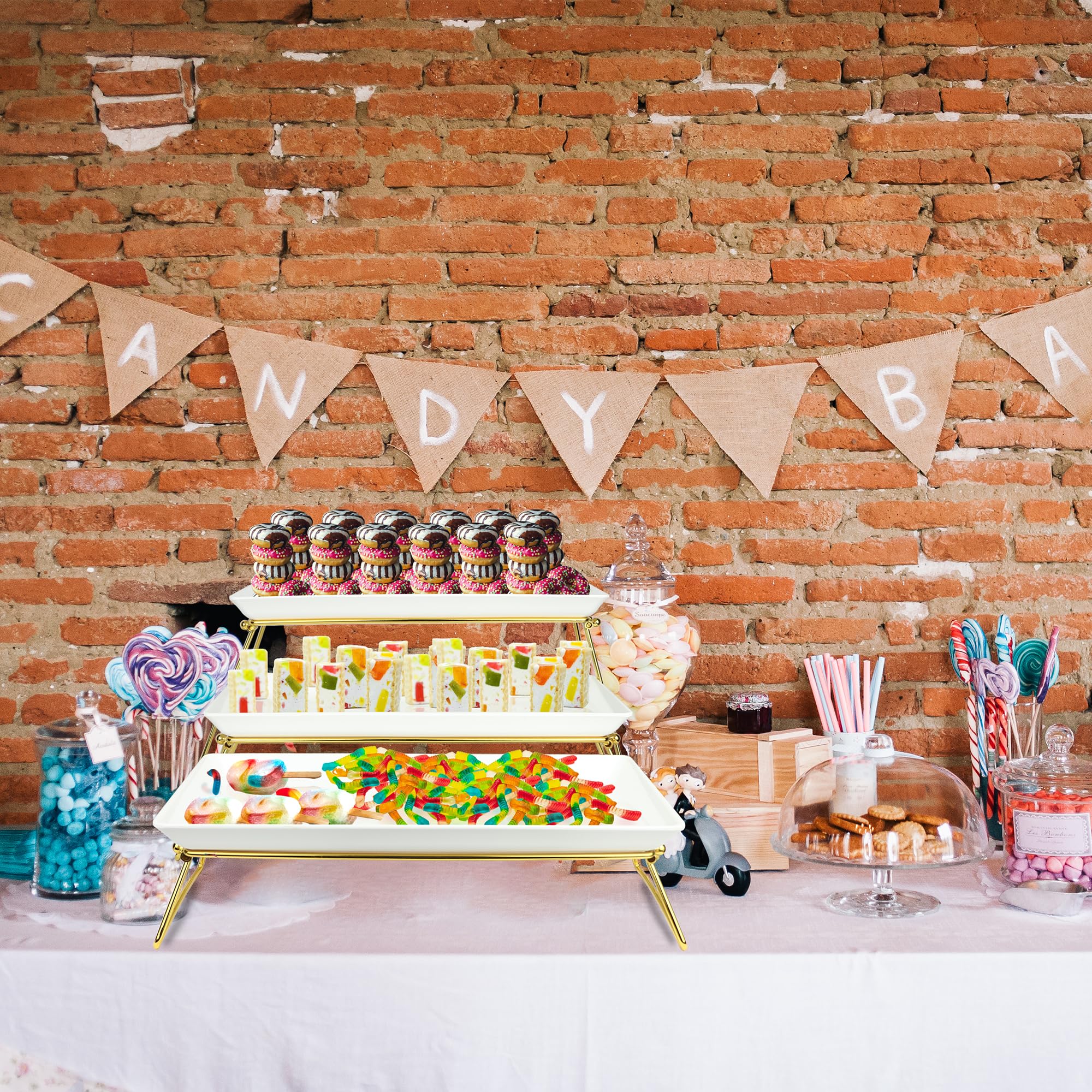 ECOIOU white and gold tiered stand highlighting cakes and pastries.