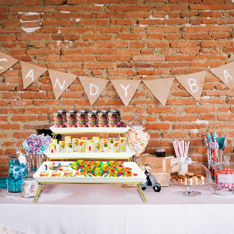 ECOIOU white and gold tiered stand highlighting cakes and pastries.