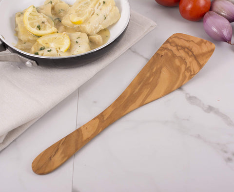 Front view of Eddingtons olive wood spatula showing smooth grain and durability