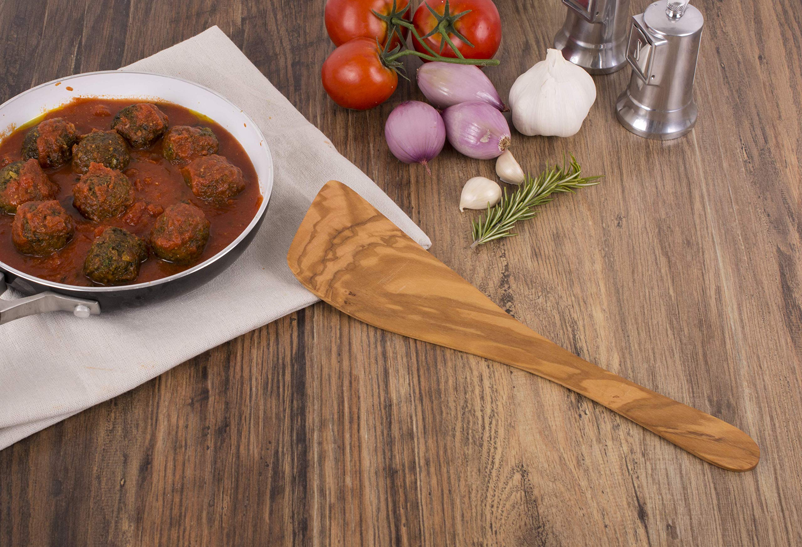 Eddingtons olive wood wide spatula resting on counter, warm and decorative