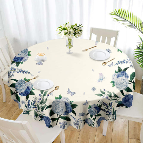 Eikione Round Tablecloth with edge pattern enhances indoor dining ambiance.