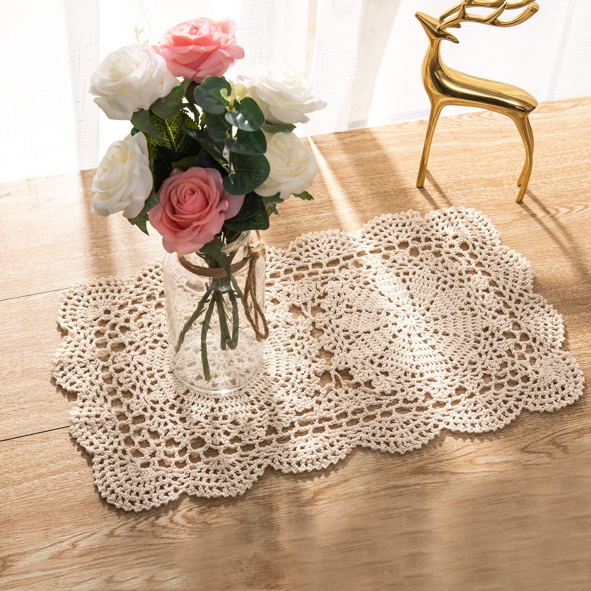 Eiyye doilies under candleholders on table displaying elegant display.