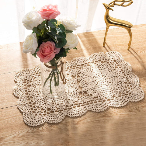 Eiyye doilies under candleholders on table displaying elegant display.