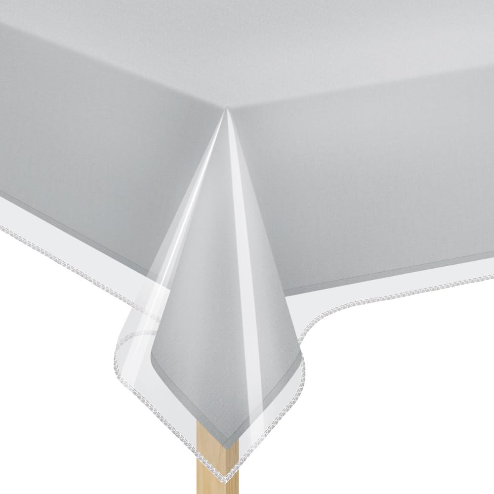 Elaine Karen crystal-clear table cover protecting linens from spills and showing design.
