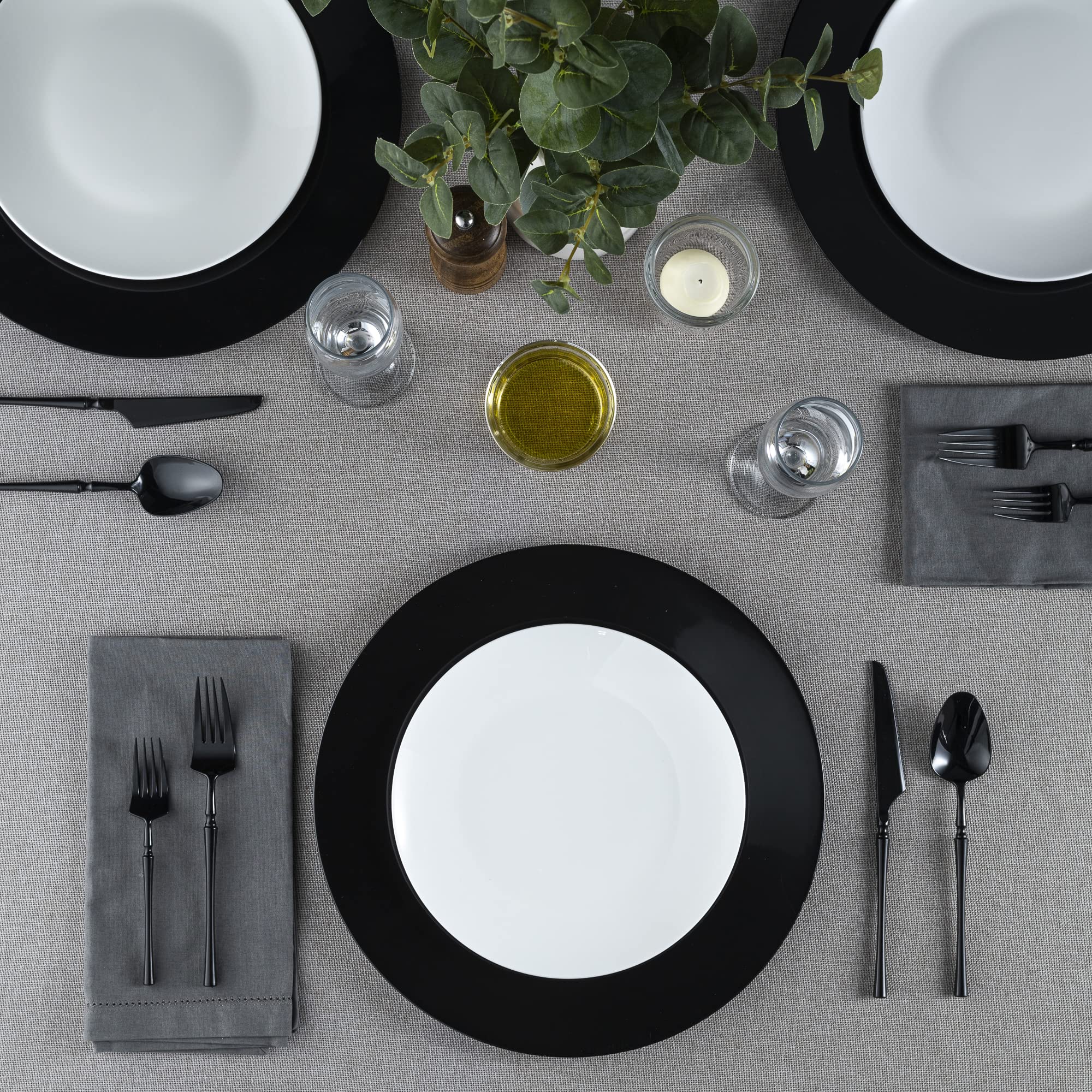 Elegant Disposables 13-inch black charger plate ideal for hot or cold food service