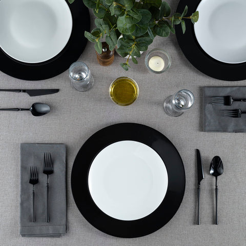 Elegant Disposables 13-inch black charger plate ideal for hot or cold food service
