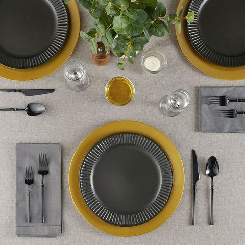 ELEGANT DISPOSABLES chargers on table setup for a wedding reception.