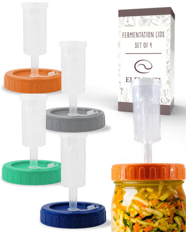 Elementi mason jar fermentation lids on wide-mouth jars for airtight seals.