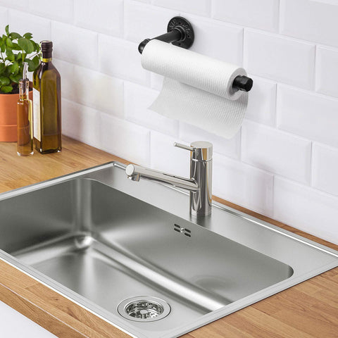 Elibbren bathroom setup shows towel or paper holder keeping surfaces neat.
