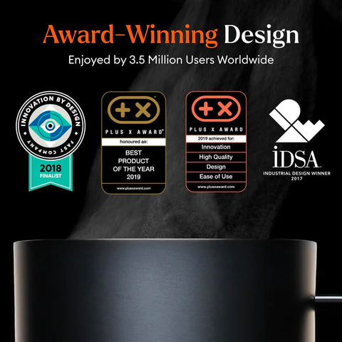 Sleek black Ember Mug 2 on a desk setup.