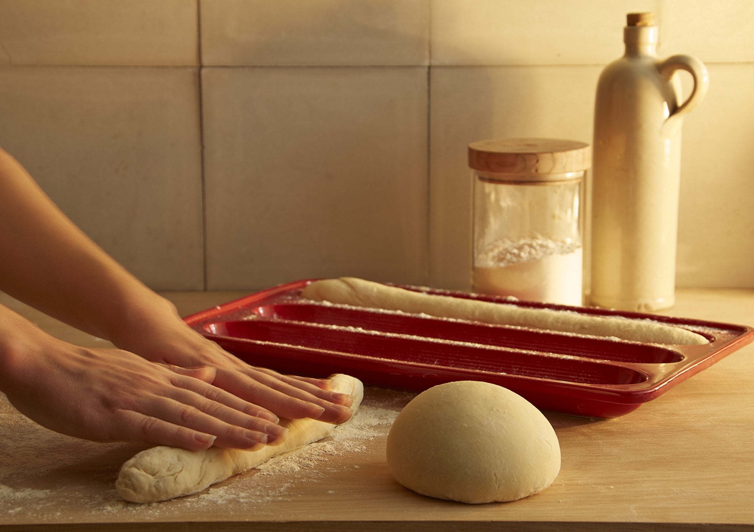 Emile Henry baguette baker withstands freezer to oven transitions for flexible cooking.