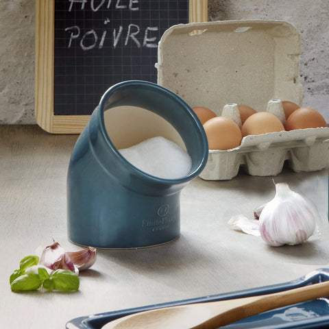 Emile Henry salt pig featuring an arched hood to keep salt clean.