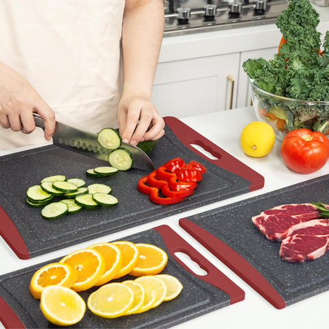 Empune red cutting board as a kitchen essential for prep tasks.