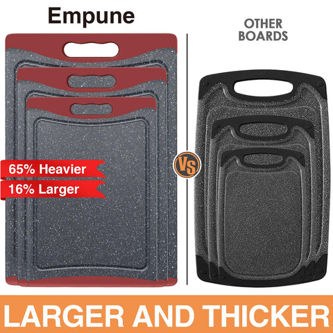 Empune large cutting board with easy-grip handles for stable chopping.
