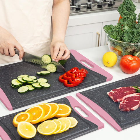 Empune pink cutting boards stack neatly for compact kitchen storage.