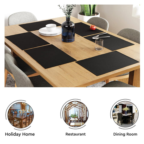 Coordinating Encasa XO tablecloth in solid black for a unified setup.