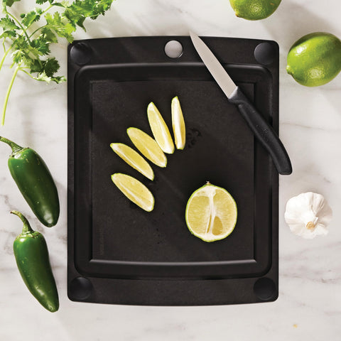 Epicurean board showing non-slip feet keeping it steady during chopping.