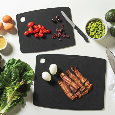 Slate Epicurean cutting board in use for easy prep and cleanup in a modern kitchen.