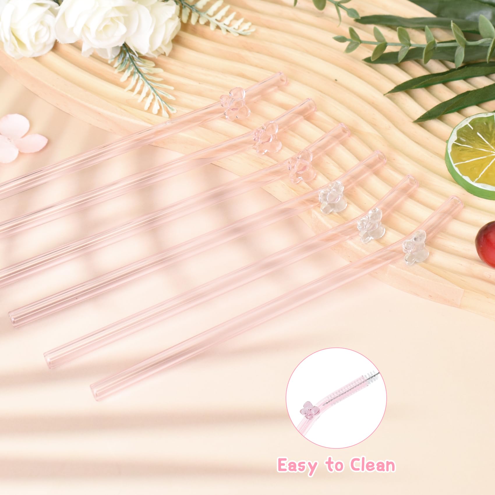 Eremaoy pink bow glass straw in a cocktail, elegant and reusable.