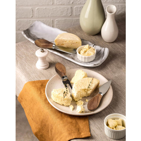 Esie Houzie in-use cheese board with multiple cheese types