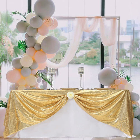 Eternal Beauty gold tablecloth on a dining table for an elegant celebration.