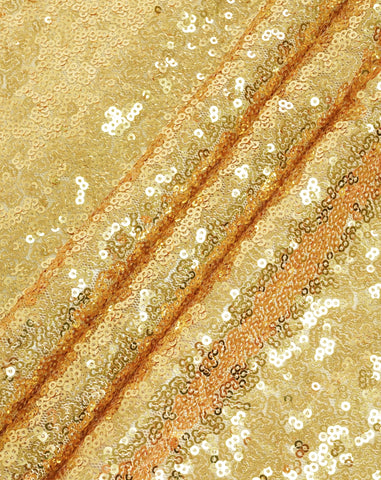 Eternal Beauty gold sequin tablecloth catches light for festive table settings.