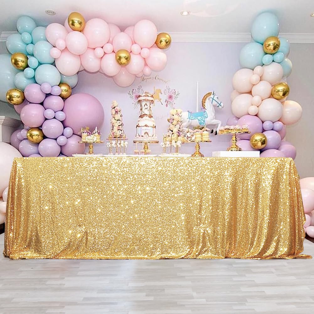 Eternal Beauty gold sequin rectangle tablecloth as wedding decor under warm lights.