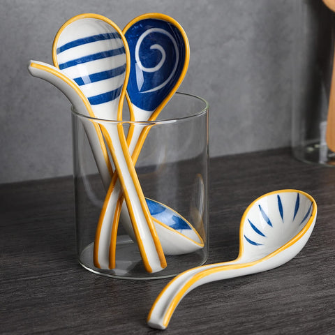 Evannt porcelain spoon featuring patterned head for elegant table settings