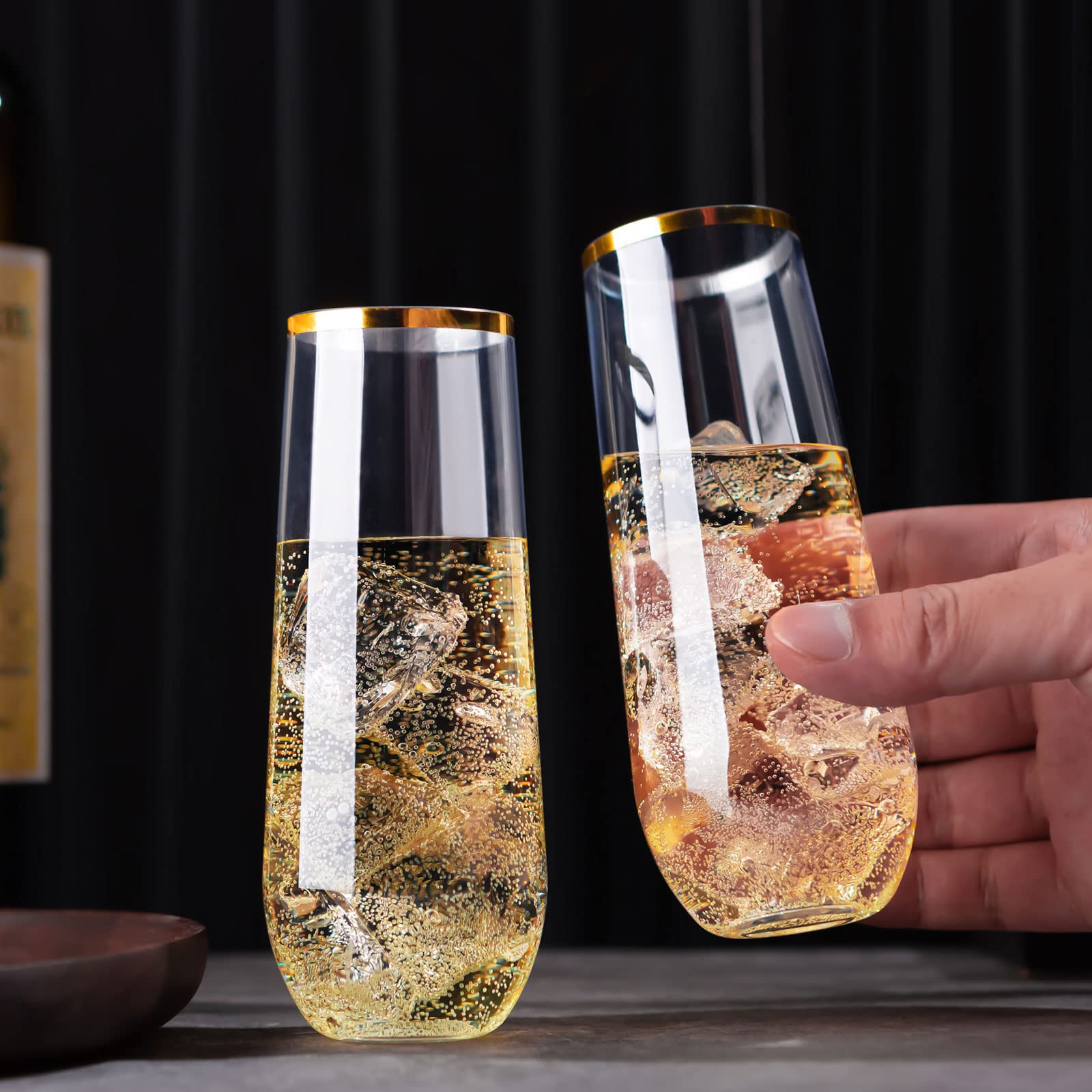 Elegant plastic champagne glasses with gold rim for upscale event decor