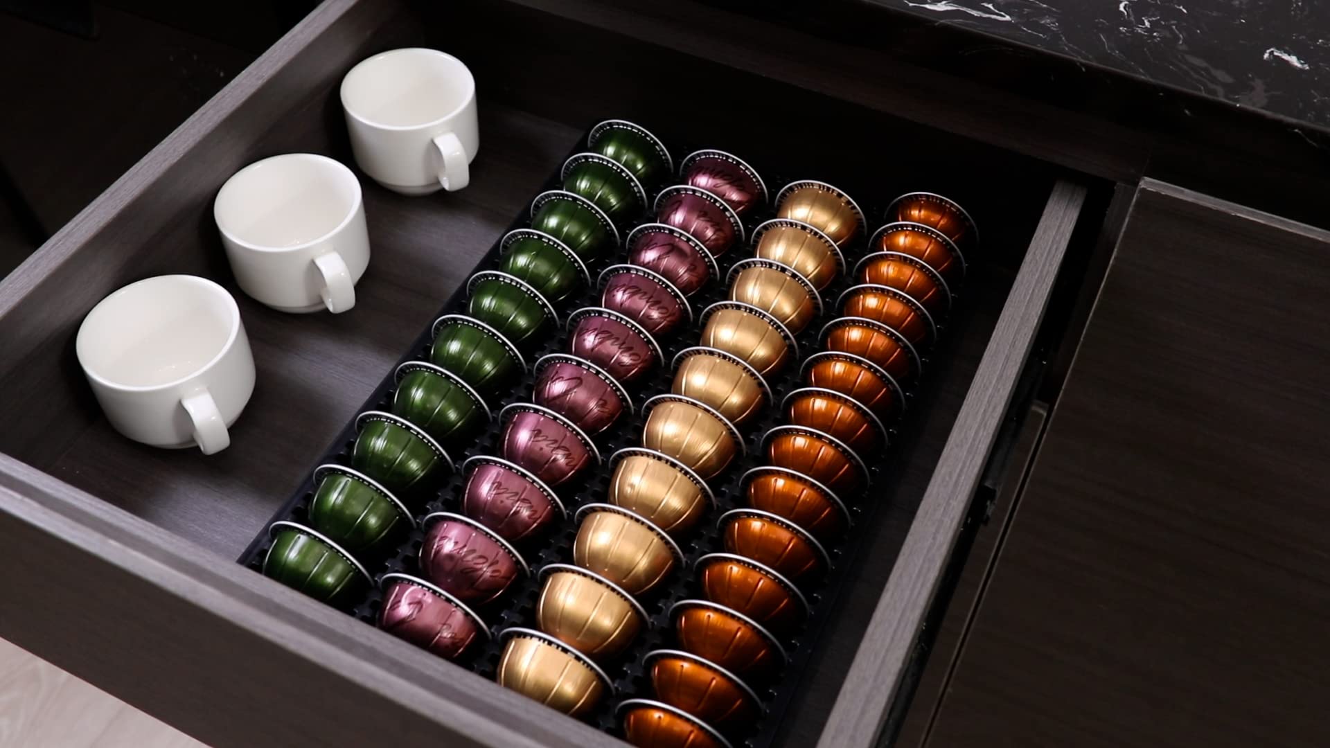 Compact drawer-fit coffee pod organizer keeps pods within easy reach.