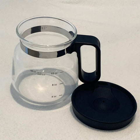 EXIGENT mug with sip-style lid for on-the-go tea and coffee convenience.