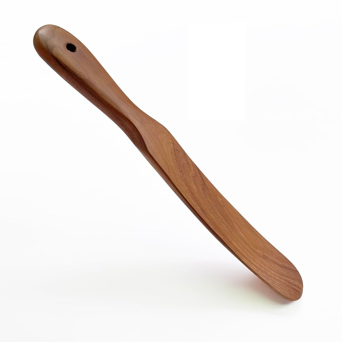 FAAY Teak Spurtle stirs sourdough starter in a deep jar.