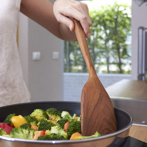 FAAY wooden spatula with 3-inch wide head designed to follow pan curves.