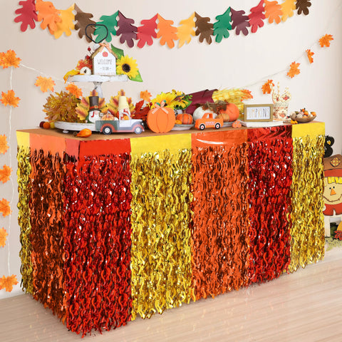 Faiclrr fall table skirt in red orange gold with foil fringe enhances festive tables.