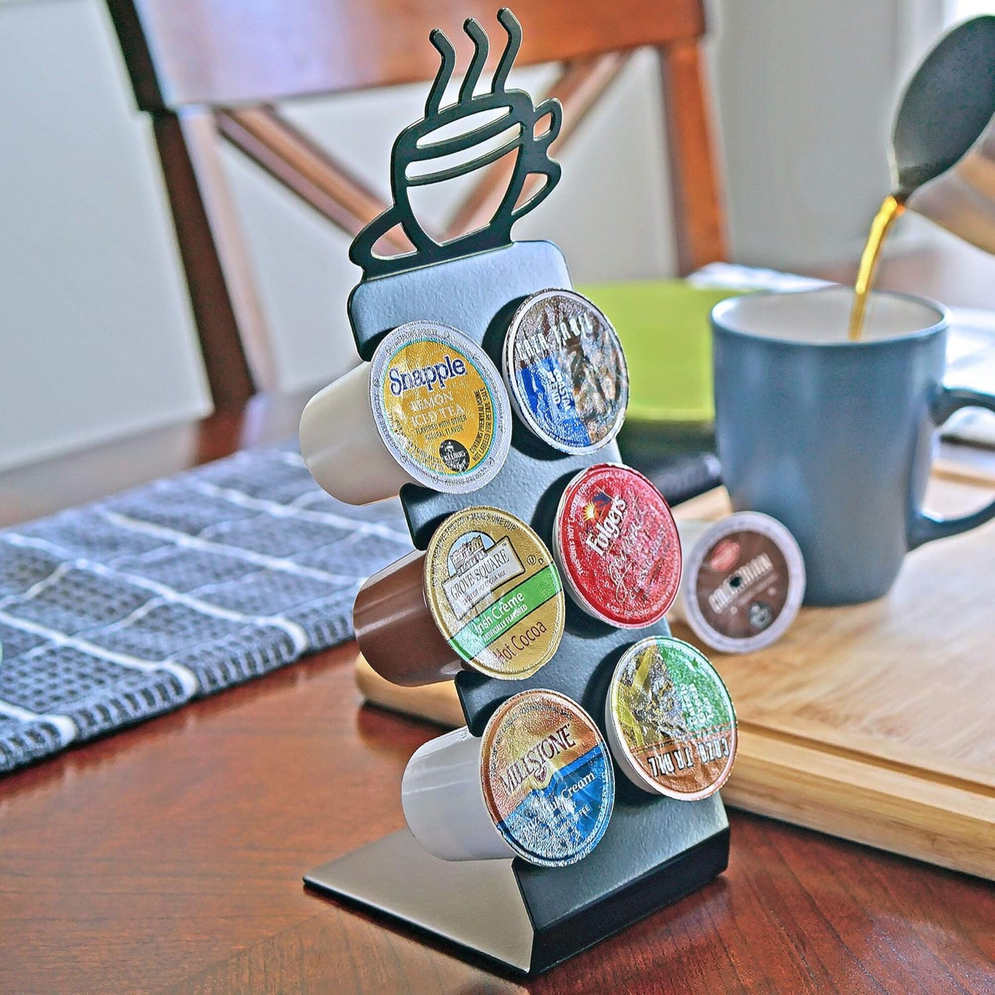 Steel stand with a steaming coffee cup motif elevates the counter.