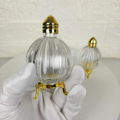 Fairturk clear-glass shaker set allows easy monitoring of salt levels.