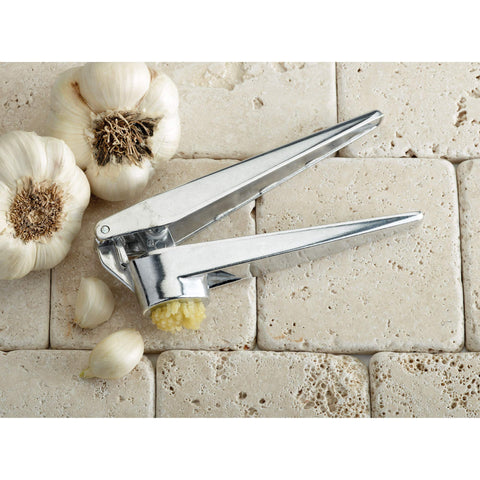 Fantes Cousin Umberto’s garlic press with unpeeled clove ready to press