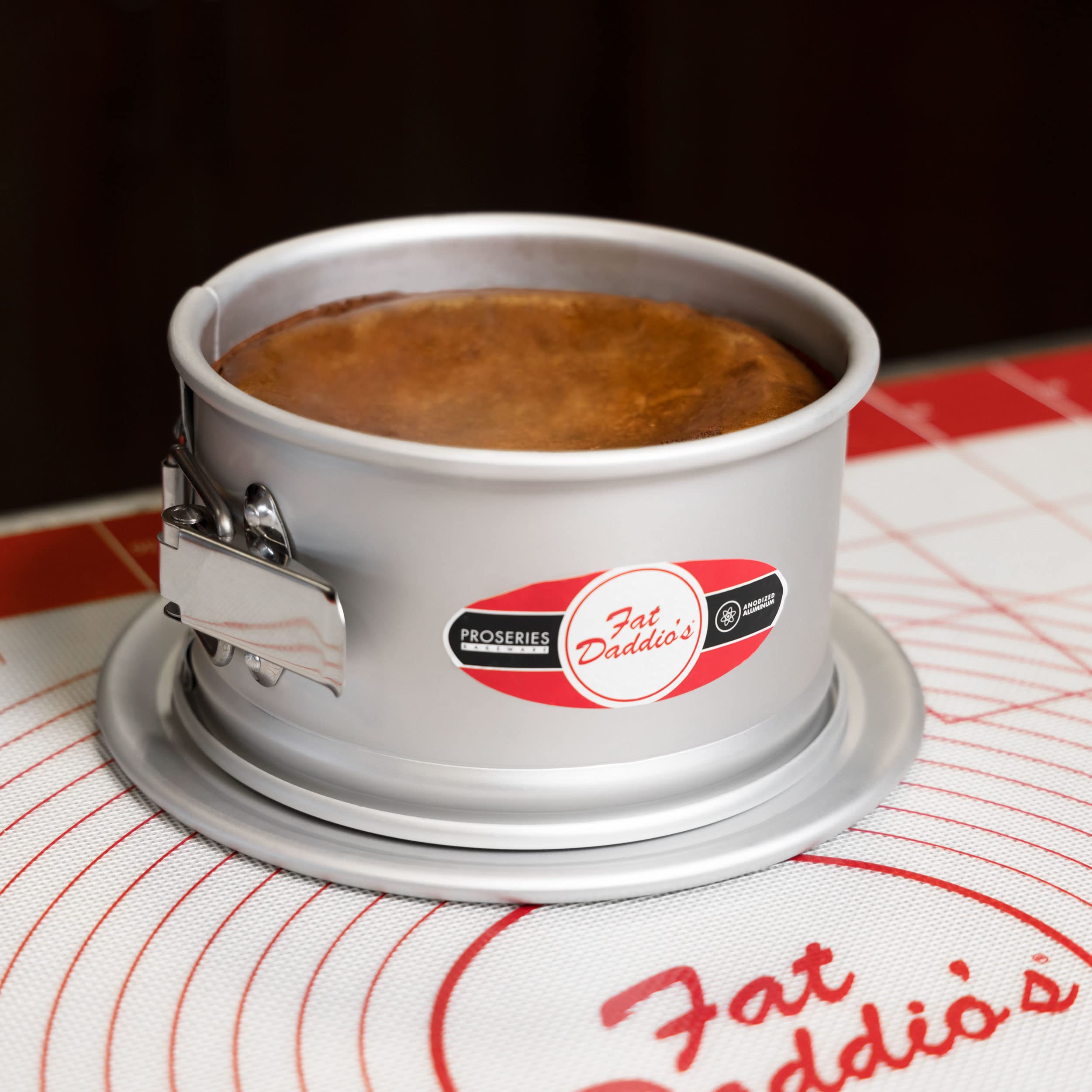 Fat Daddio's round springform pan secure latch ensures stable baking.