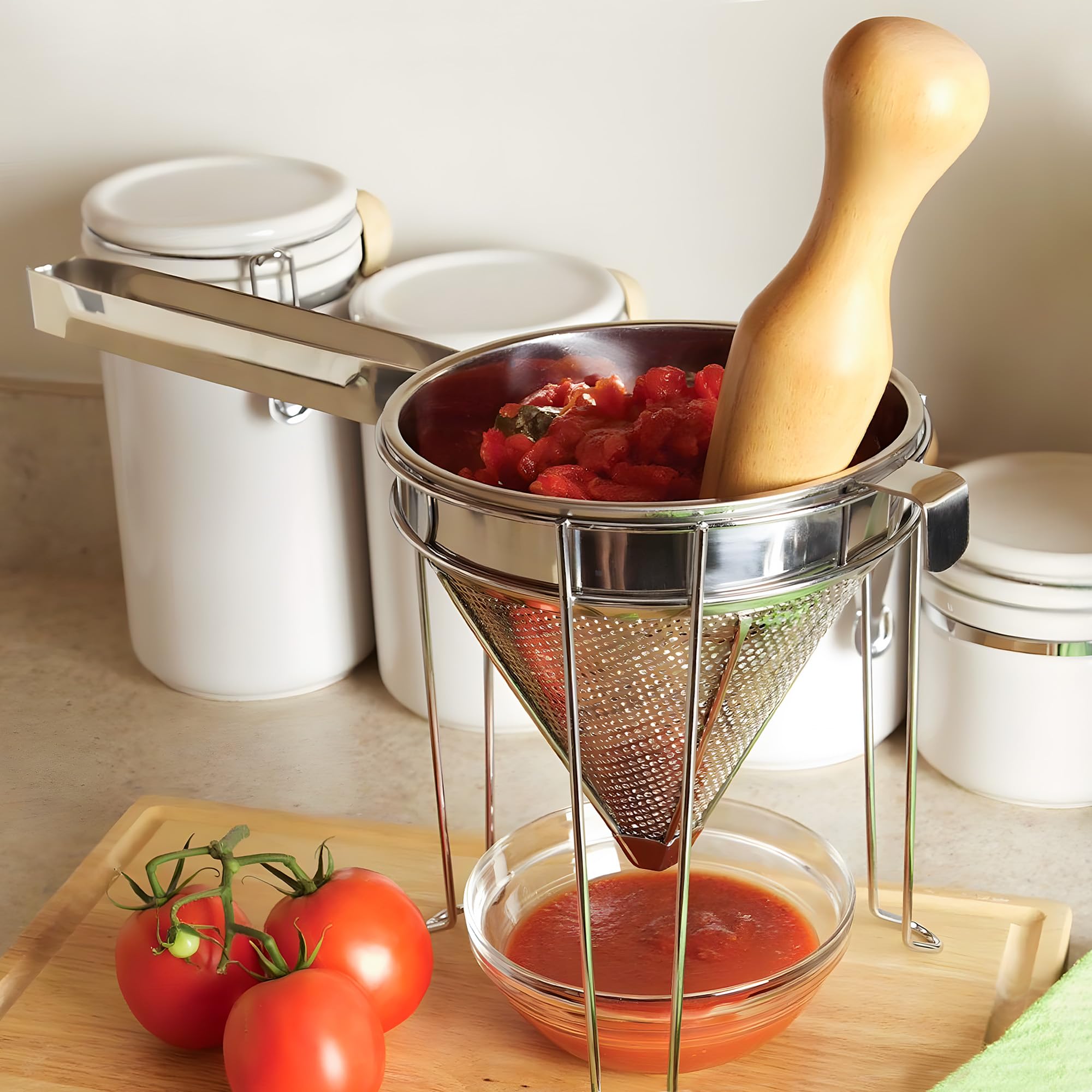 Feekoon chrome stand supports strainer while pressing through mesh.