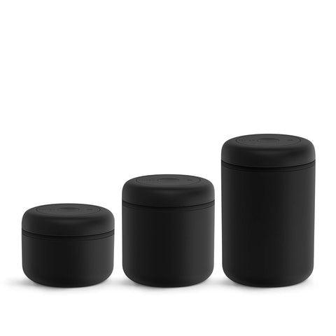 Fellow Atmos stainless steel container lid close-up highlights airtight seal for aroma protection.