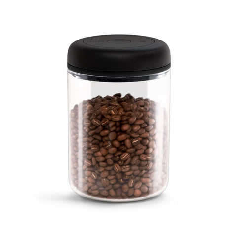 Fellow Atmos vacuum canister lid-twist action helps reduce air for fresher coffee.