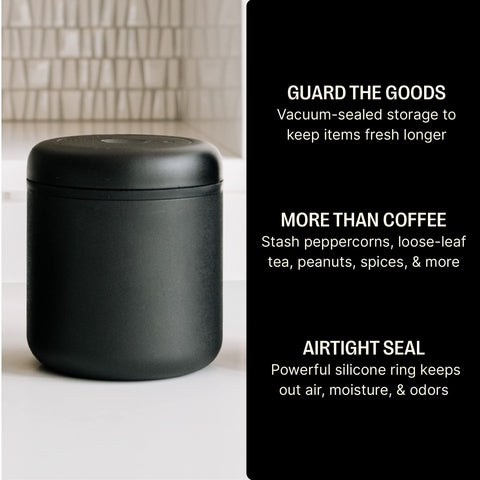 Atmos vacuum seal action demonstrates twist-to-remove-air on the lid for freshness.