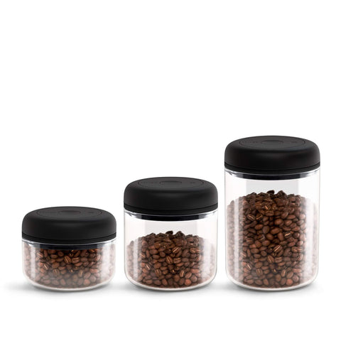 Fellow Atmos vacuum lid twist-action demonstrates easy air extraction for freshness.