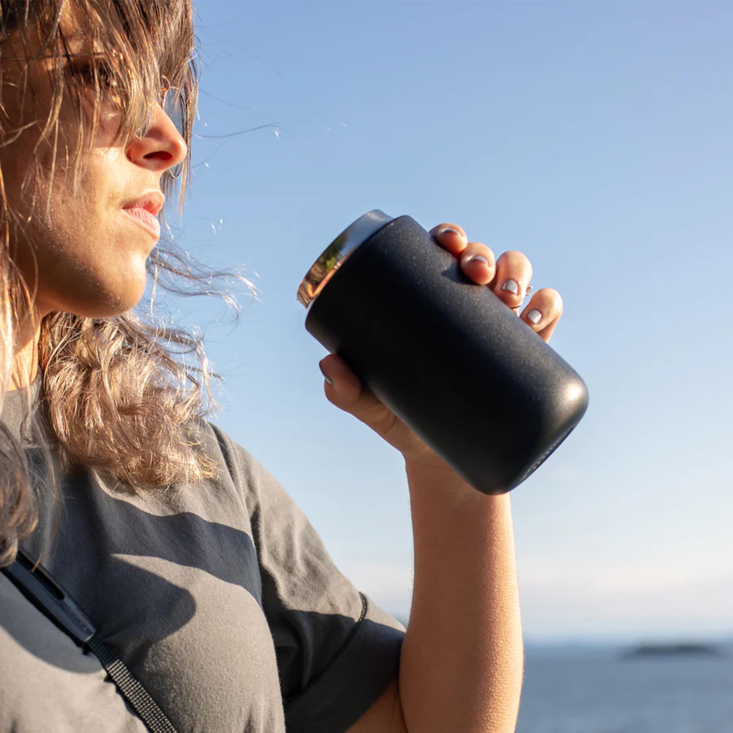 Fellow Carter Move matte black exterior highlights a sleek, portable travel mug for daily use