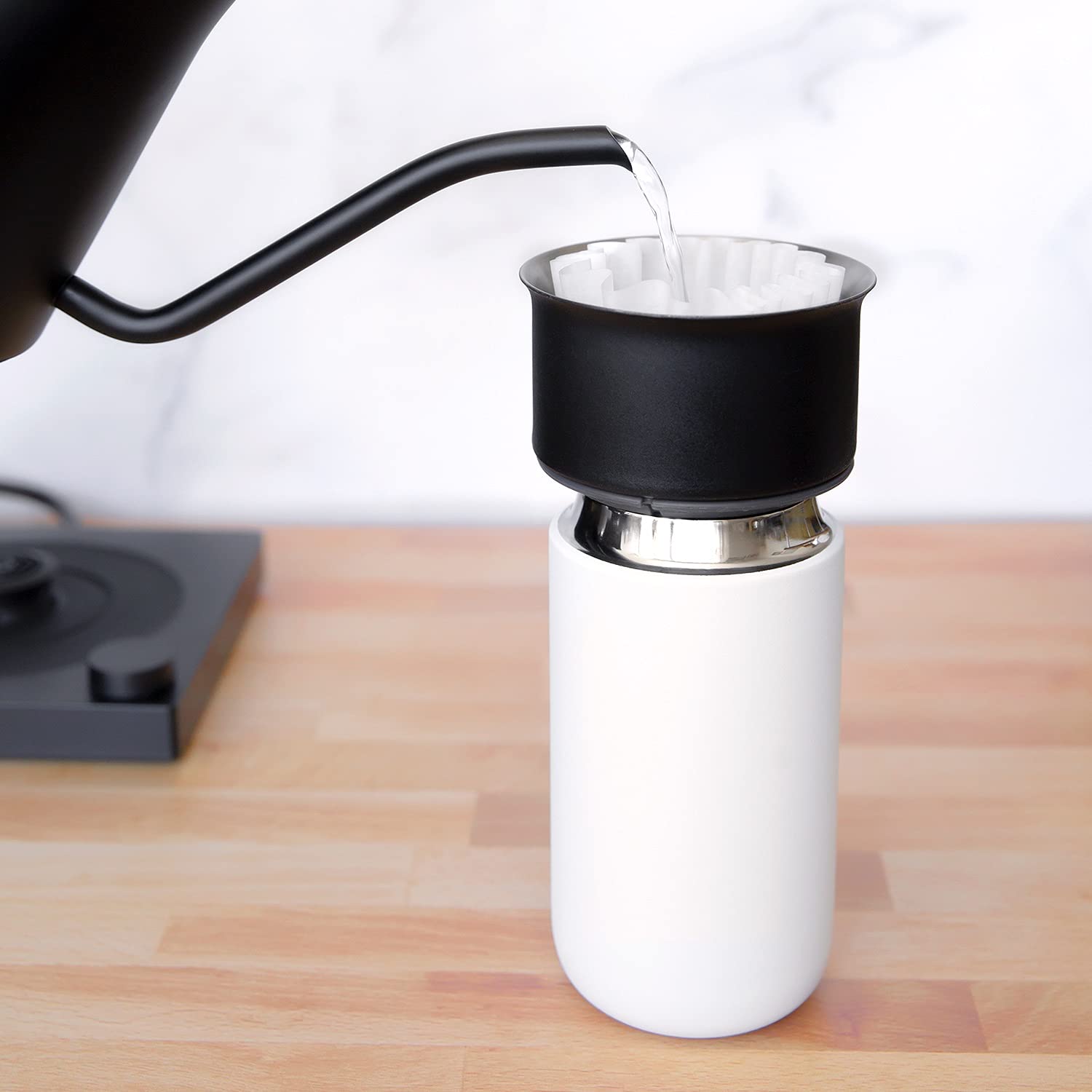 Fellow Carter Move mug with ceramic interior preserves pure coffee taste.