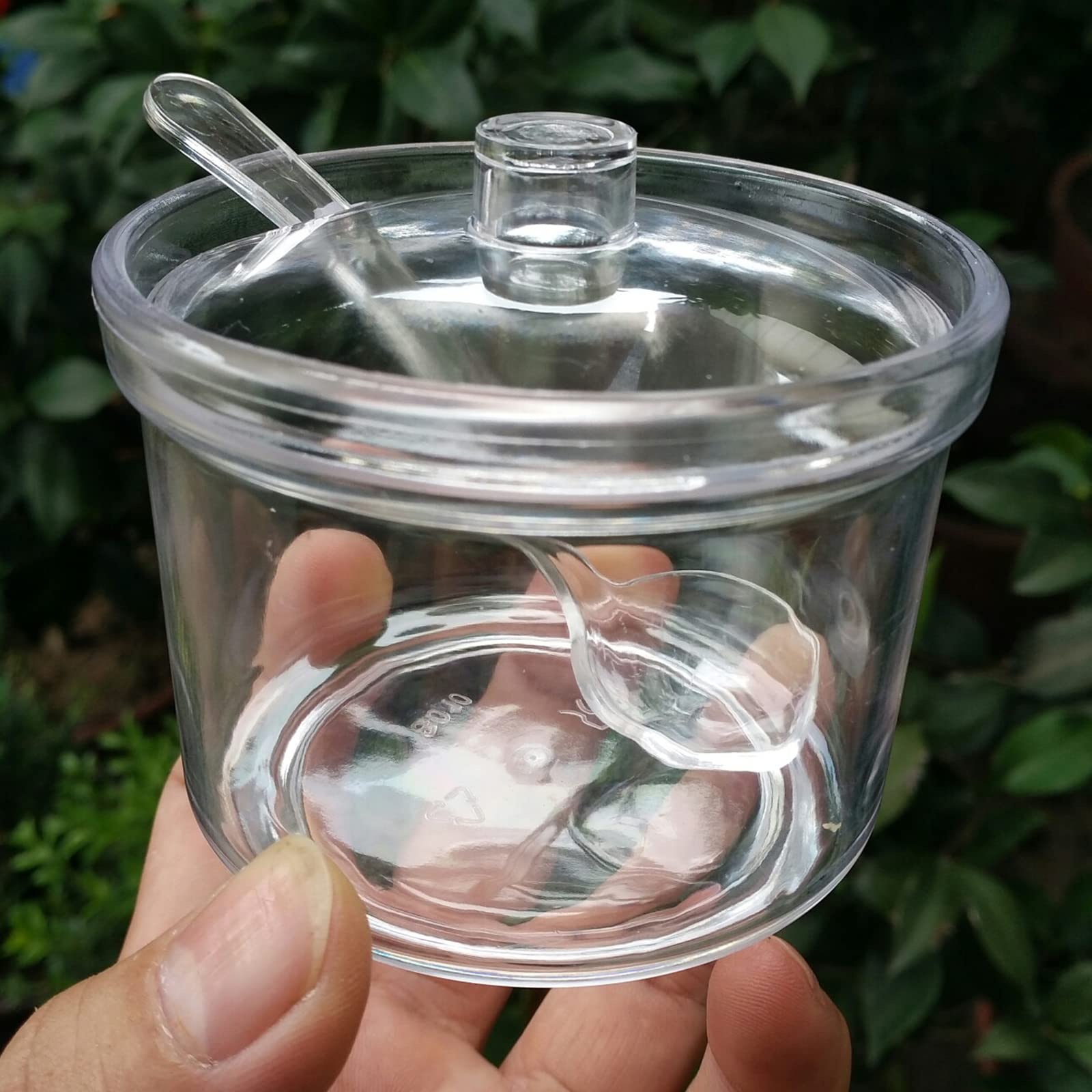FEOOWV clear acrylic tea container with 210ml capacity for storage.