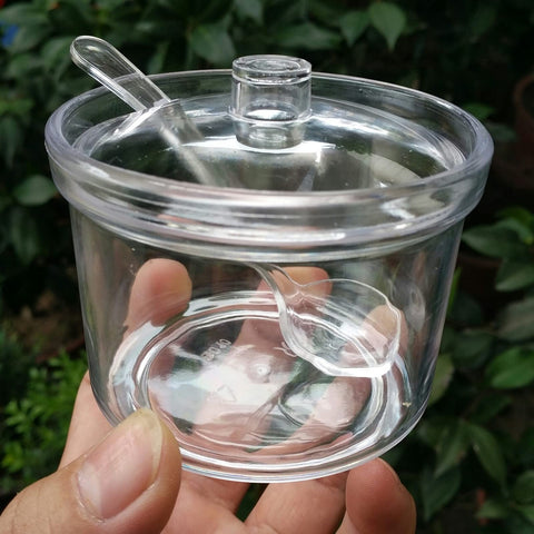 FEOOWV clear acrylic tea container with 210ml capacity for storage.