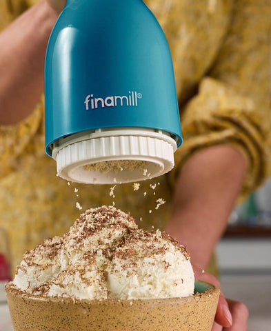 FinaMill interchangeable pods visible showing separate flavor zones.