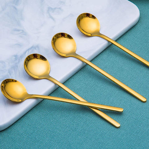 findTop mirror-finish spoons closeup showing shiny heads and smooth edges.