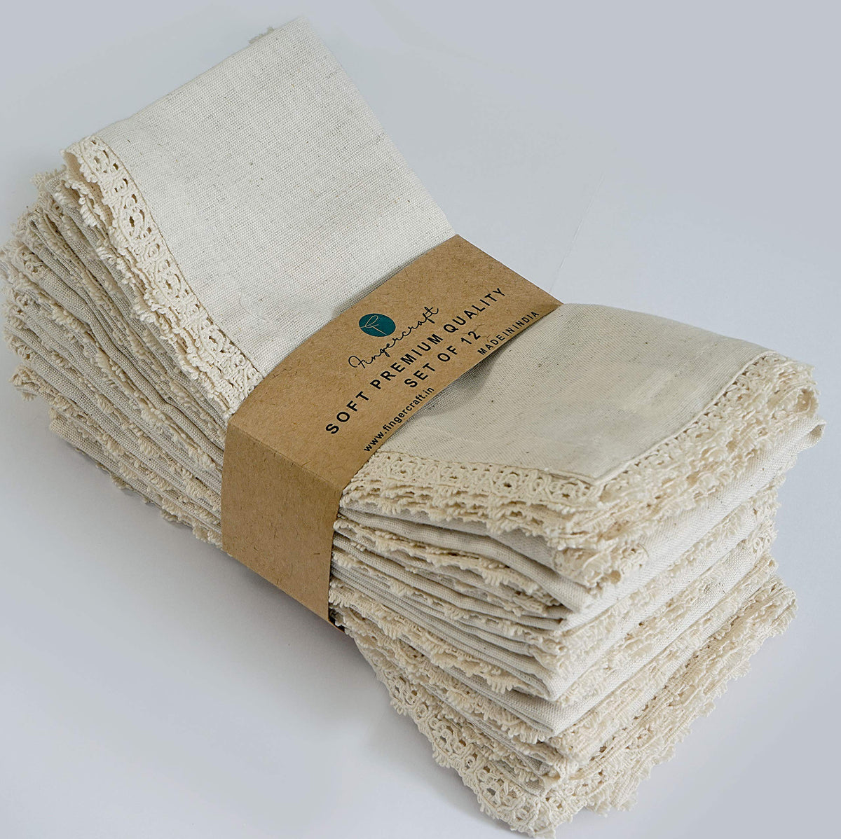 FingerCraft dinner napkins 12-pack in ivory on table for everyday dining elegance